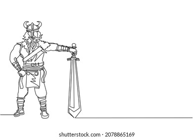 Single one line drawing male viking with strong physique and bellicose air stands holding sword. Norseman warrior wearing horned helmet with beard holding sword. Continuous line draw design vector