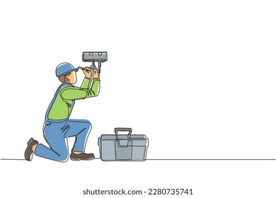 Single one line drawing male plumber in overall is installing water heater or boiler. Home repair, maintenance and plumbing services. Handyman concept. Continuous line draw design vector illustration