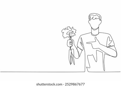 Single one line drawing man holding some carrots with the tips of the leaves still thick. Plays role in bone health. Carbohydrate. International Carrot Day. Continuous line design graphic illustration