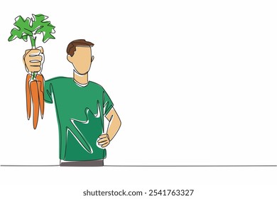 Single one line drawing man holding some carrots with the tips of the leaves still thick. Posing happily. A bountiful harvest. International Carrot Day. Continuous line design graphic illustration