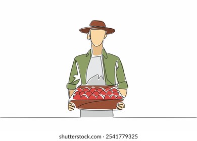 Single one line drawing a man wearing a hat carrying a wooden box filled with tomatoes. Gardener. A harvest very beneficial for the body. Fresh Tomato Day. Continuous line design graphic illustration