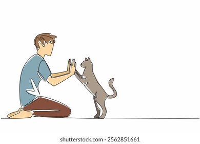 Single one line drawing a man in casual clothes sitting on the floor giving a high five to a cat. Very familiar with beloved pets. National High Five Day. Continuous line design graphic illustration