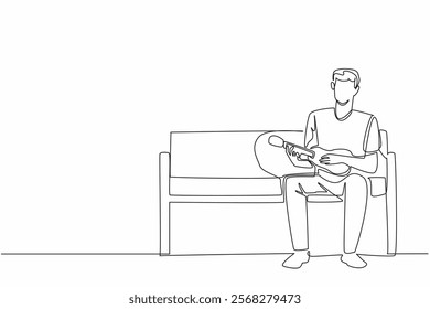 Single one line drawing a man sitting on park bench plays the ukulele. Hobby playing musical instruments. Singing anywhere. National Play Your Ukulele Day. Continuous line design graphic illustration