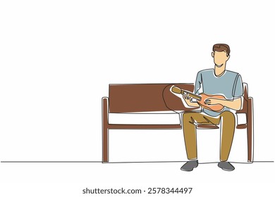 Single one line drawing a man sitting on park bench plays the ukulele. Hobby playing musical instruments. Singing anywhere. National Play Your Ukulele Day. Continuous line design graphic illustration