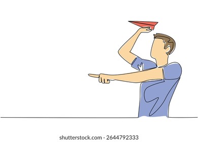 Single one line drawing a man in casual clothes stands and holds a paper airplane. Repeating childhood hobbies. Creativity. National Paper Airplane Day. Continuous line design graphic illustration
