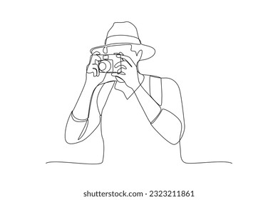 Single one line drawing  Photographer with camera. World photography day concept. Continuous line draw design graphic vector illustration.