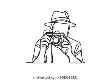 Single one line drawing Photographer with camera. World photography day concept continuous line draw design.