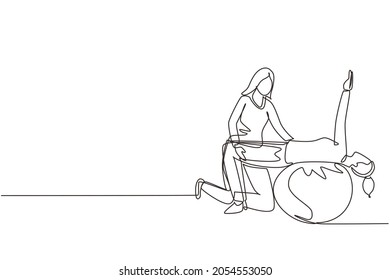 Single one line drawing physiotherapy rehabilitation isometric with woman patient lying on top of rubber ball and lifting her hands with medical assistant help. Continuous line draw design vector