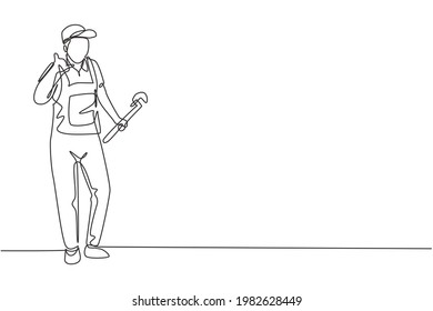 Single one line drawing plumber stands with call me gesture and holding carpentry tool fixing broken plumbing at home. Success business. Modern continuous line draw design graphic vector illustration