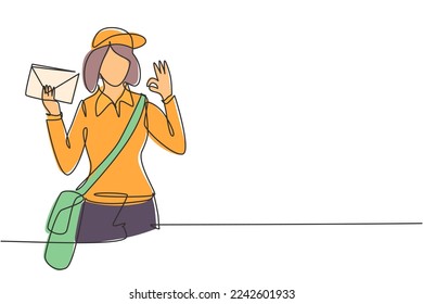 Single one line drawing postwoman wearing hat, sling bag, and uniform with gesture okay holds envelope to delivered to home address. Modern continuous line draw design graphic vector illustration