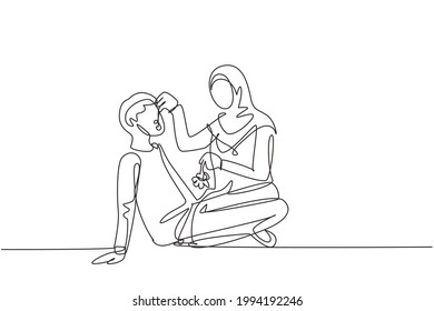 Single one line drawing romantic Arabian couple having picnic in park. Relaxing together sitting on the ground and women feeding grapes to men. Continuous line draw design graphic vector illustration