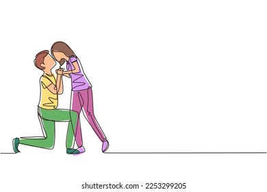 Single one line drawing romantic male kneel and kissing female. Couple lovers kissing and holding hands. Happy man and woman celebrating wedding anniversary. Modern continuous line draw design graphic