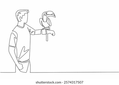 Single one line drawing toucan bird perched on hand of man. The most attractive bird in the zoo. Long orange beak. Not good at flying. Man Holding Bird. Continuous line design graphic illustration