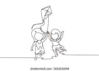 Single one line drawing two girl playing to fly kite up into sky at outdoor field. Kids playing kite in playground. Children with kites game and they look happy. Continuous line draw design graphic