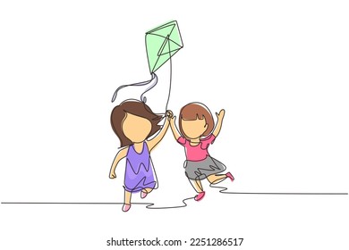 Single one line drawing two girl playing to fly kite up into sky at outdoor field. Kids playing kite in playground. Children with kites game and they look happy. Continuous line draw design graphic