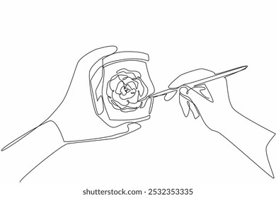 Single one line drawing two hands painting roses on jar using paint brush. Decorate to make it more beautiful and pleasing to eye. National Handmade Day. Continuous line design graphic illustration