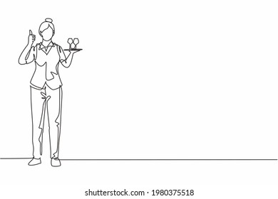 Single one line drawing of waitress stood up with thumbs-up gesture and brought a tray of drinking glasses to offer to restaurant guests. Modern continuous line draw design graphic vector illustration