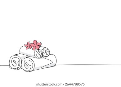 Single one line drawing white towels rolled up and stacked with pink flowers on top. Clean towels prepared for special guests at the hotel. Towel Day. Continuous line design graphic illustration