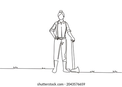 Single one line drawing woman lumberjack with axe standing wearing suspender shirt, jeans and boots. Female woodcutter pose on logging forest. Continuous line draw design graphic vector illustration