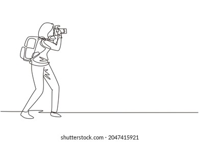 Single one line drawing woman photographer or paparazzi taking photo with modern digital cameras with angles. Journalists or reporters with backpack making pictures. Continuous line draw design vector