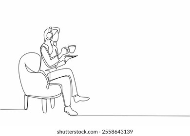 Single one line drawing woman sitting on sofa enjoying warm tea wearing headphones. Double pleasure makes more relaxing. Classical music. National Tea Day. Continuous line design graphic illustration