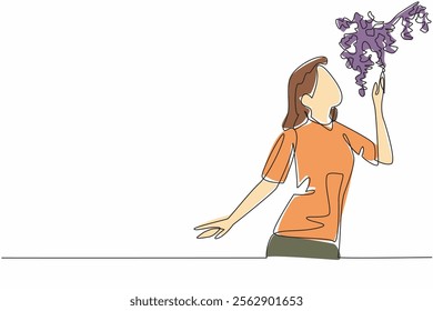 Single one line drawing a woman smells the scent of hanging flowers. Curious about the scent that is so fragrant. Luxury. National Sense Of Smell Day. Continuous line design graphic illustration