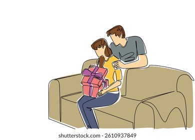 Single one line drawing a woman sitting on the sofa while opening a gift box. Feeling touched and happy. Getting a beautiful surprise. Happiness. Surprise. Continuous line design graphic illustration