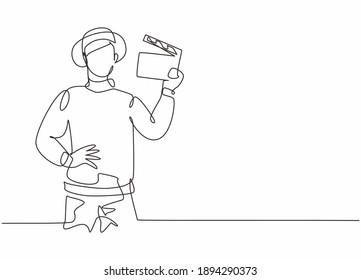 Single one line drawing of young smart male film director holding clapperboard. Professional work profession and occupation minimal concept. Continuous line draw design graphic vector illustration