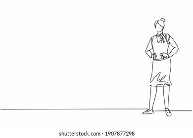 Single one line drawing young female stewardess standing posing with hands on hip. Professional work profession and occupation minimal concept. Continuous line draw design graphic vector illustration