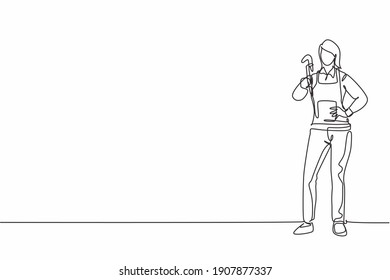 Single one line drawing of young beauty female plumber posing with hands on hip. Professional work profession and occupation minimal concept. Continuous line draw design graphic vector illustration