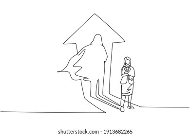 Single one line drawing of young smart businesswoman standing with superhero shadow behind her. Business finance growth minimal concept. Modern continuous line draw design graphic vector illustration