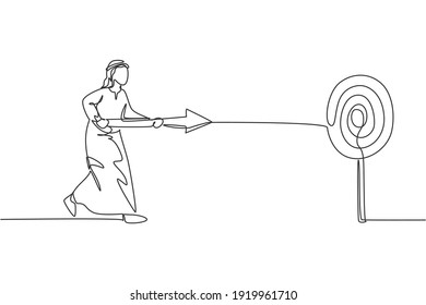 Single one line drawing young attractive Arab male entrepreneur holding arrow spear to hit target. Business focus goal minimal concept. Modern continuous line draw design graphic vector illustration