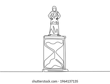 Single one line drawing of young Arabian business woman standing above hourglass. Symbol to show time management business minimalist concept. Continuous line draw design graphic vector illustration.