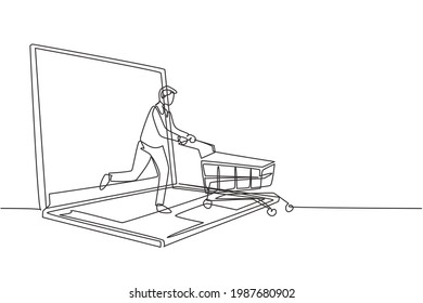 Single one line drawing young man coming out of laptop screen pushing a shopping cart. Sale, digital lifestyle, consumerism concept. Modern continuous line draw design graphic vector illustration