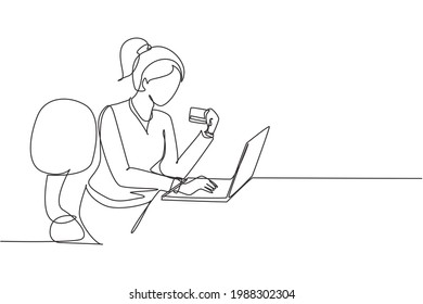Single one line drawing young woman sitting on chair and typing entering credit card code on laptop around desk. Digital payment concept. Modern continuous line draw design graphic vector illustration