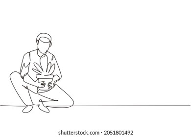 Single one line drawing young man cultivating potted plant at home. Happy guy taking care of houseplants. Male enjoying gardening growing houseplants. Continuous line draw design vector illustration