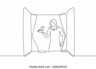 Single one line drawing young Arabian woman standing on windowsill with bird in arm. Happy female on balcony with her pet. Open window to get fresh air. Continuous line draw design vector illustration