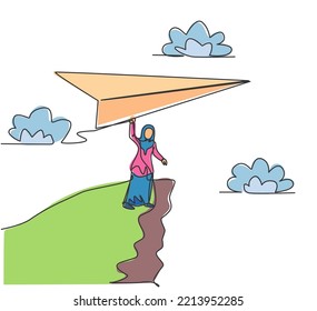 Single one line drawing of young Arab business woman holding giant paper plane on cliff. Business challenge. Minimal metaphor concept. Modern continuous line draw design graphic vector illustration