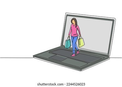 Single one line drawing young woman coming out of laptop screen holding shopping bags. Sale, digital lifestyle and consumerism concept. Modern continuous line draw design graphic vector illustration