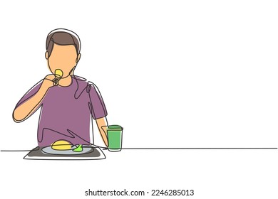 Single one line drawing young man having fruits meal with fork around table. Enjoy dessert at restaurant. Delicious and healthy food. Modern continuous line draw design graphic vector illustration