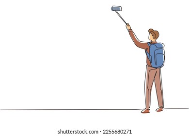 Single one line drawing young man traveler with backpack hiking in mountain while recording video using his smartphone. Travel blogger. Modern continuous line draw design graphic vector illustration