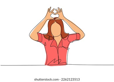 Single one line drawing young woman making or gesturing heart symbol with fingers. Modern female lifestyle, healthcare, love shape concept. Continuous line draw design graphic vector illustration