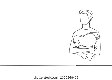Single one line drawing young trendy man and casual shirt hugging red heart symbol in his chest  Illustration mental health  Self love concept  Continuous line design graphic illustration