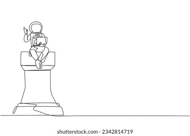 Single one line drawing young astronaut sitting on giant chess piece of rook holding laptop raise one hand. Knowing smart strategies in completing expedition missions. Continuous line design graphic