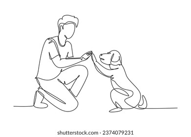 Single one line drawing of young happy boy giving high five gesture to his puppy dog at outfield park. Pet care and friendship concept. Modern continuous line draw design graphic vector illustration