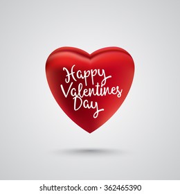 Single red heart with white text happy valentines day. Gray background and shadow.