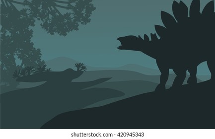 Single stegosaurus silhouette in hills beautiful scenery