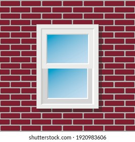 Una única ventana blanca de estilo americano sobre una pared de ladrillo rojo a la luz del día.