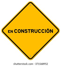 Single yellow diamond shaped en construccion safety hazard sign over white background - in English saying Under Construction