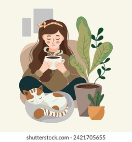 Sitting girl with steaming tea in her hand, with a sleeping cat at her feet